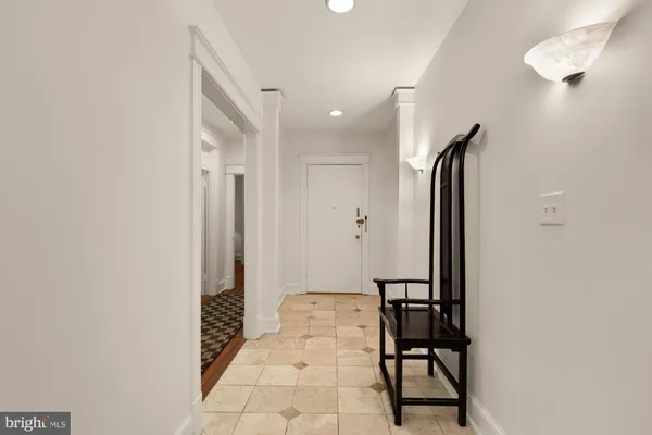 a view of a dining room with a table and chairs