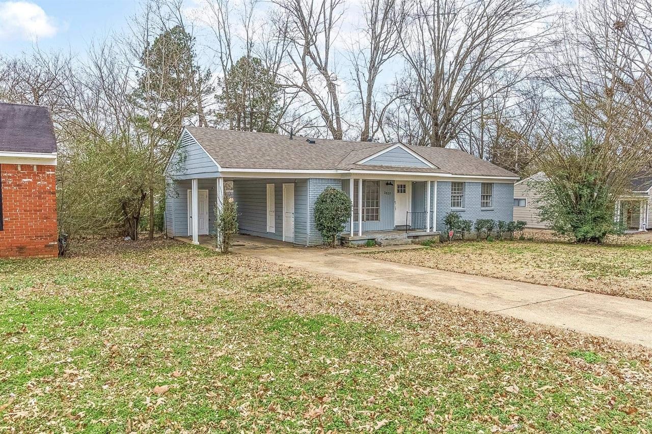 3837 Tessland Road Memphis, TN 38128 - Photo 3 of 12 a front view of a house with a garden