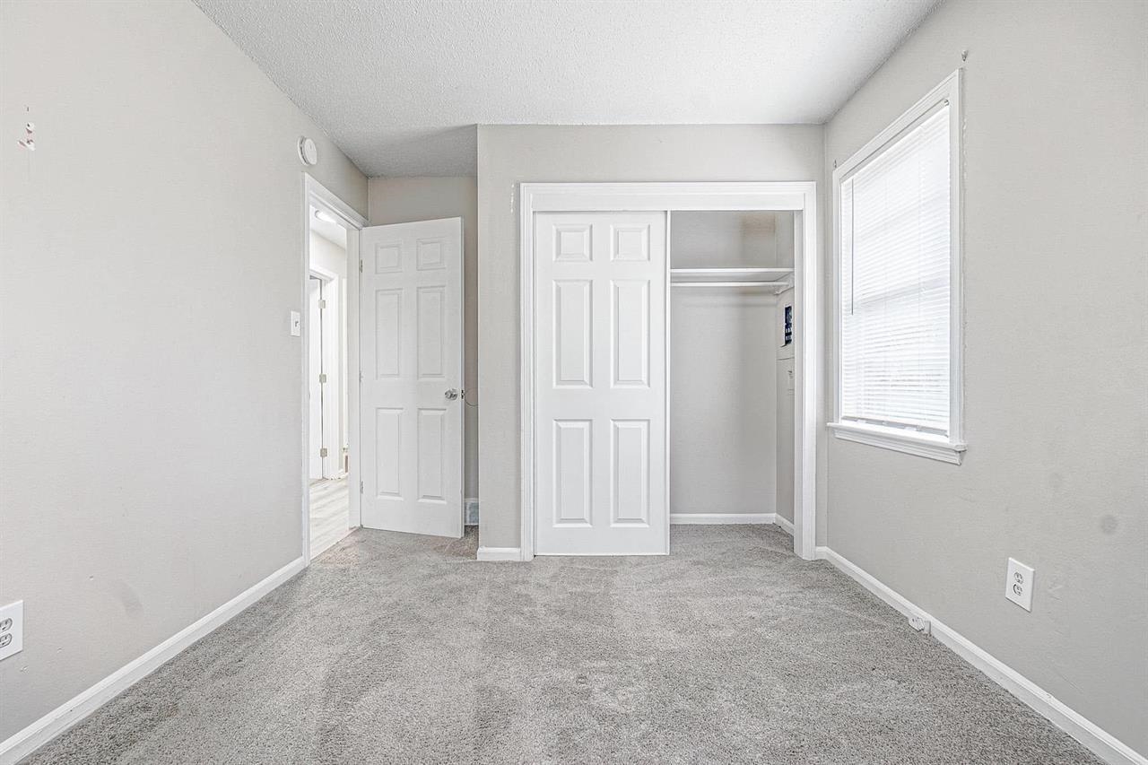 3837 Tessland Road Memphis, TN 38128 - Photo 9 of 12 an empty room with windows and closet