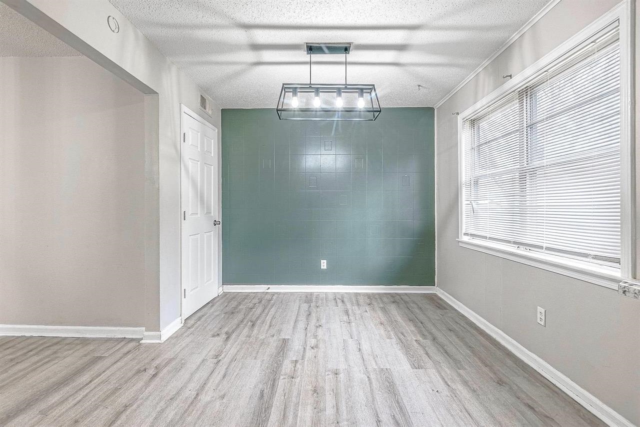 3837 Tessland Road Memphis, TN 38128 - Photo 10 of 12 a view of empty room with wooden floor