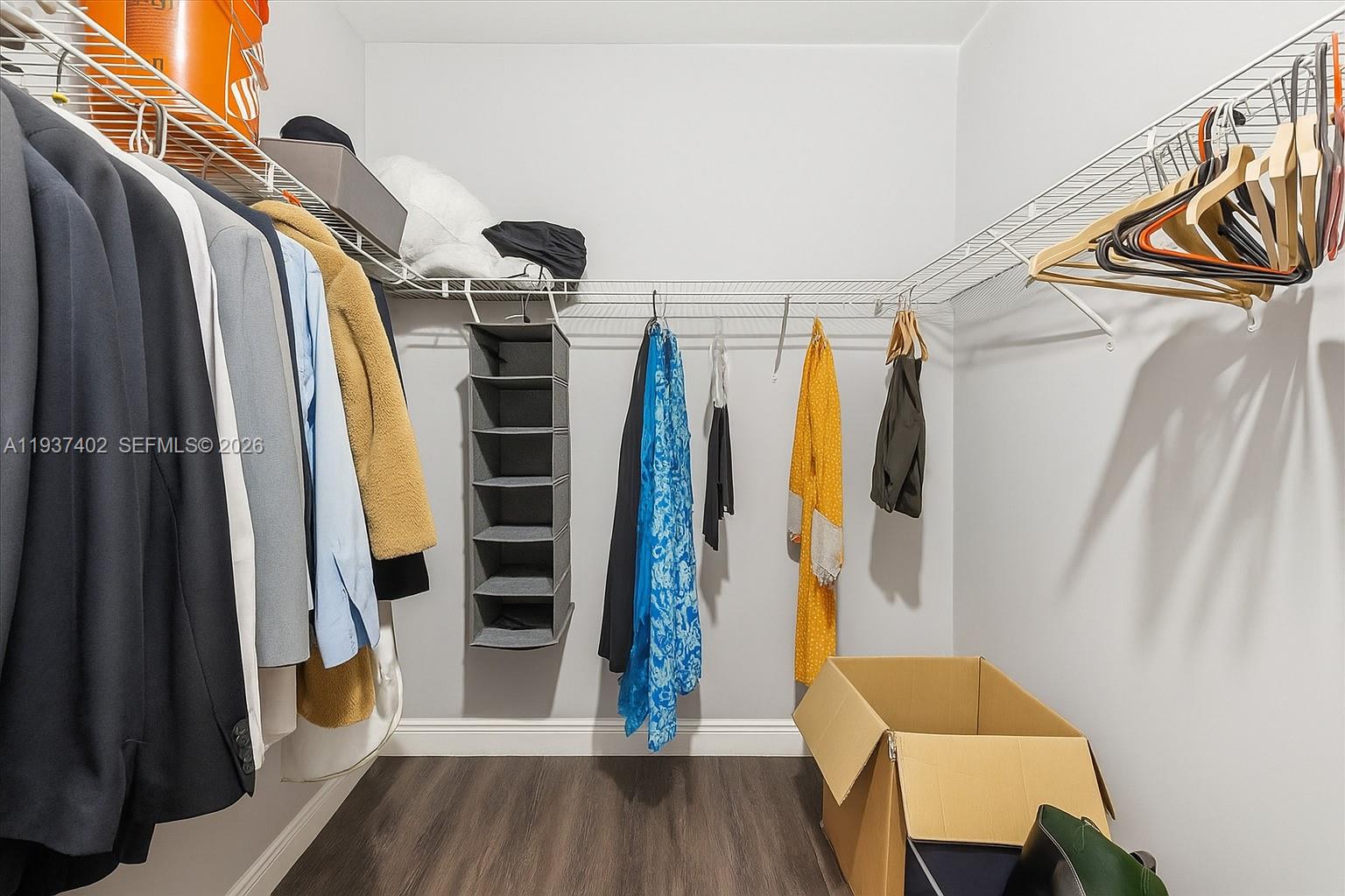 2730 Southwest 26th Street, Unit 2730 Miami, FL 33133 - Photo 12 of 21 a view of walk in closet with clothes and shoes