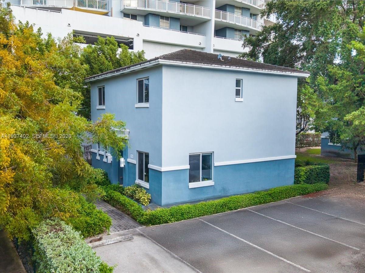 2730 Southwest 26th Street, Unit 2730 Miami, FL 33133 - Photo 3 of 21 a front view of a house with garden
