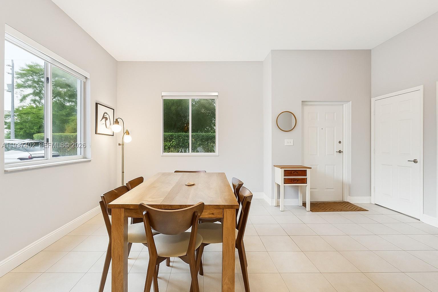 2730 Southwest 26th Street, Unit 2730 Miami, FL 33133 - Photo 6 of 21 a dining room with furniture and window