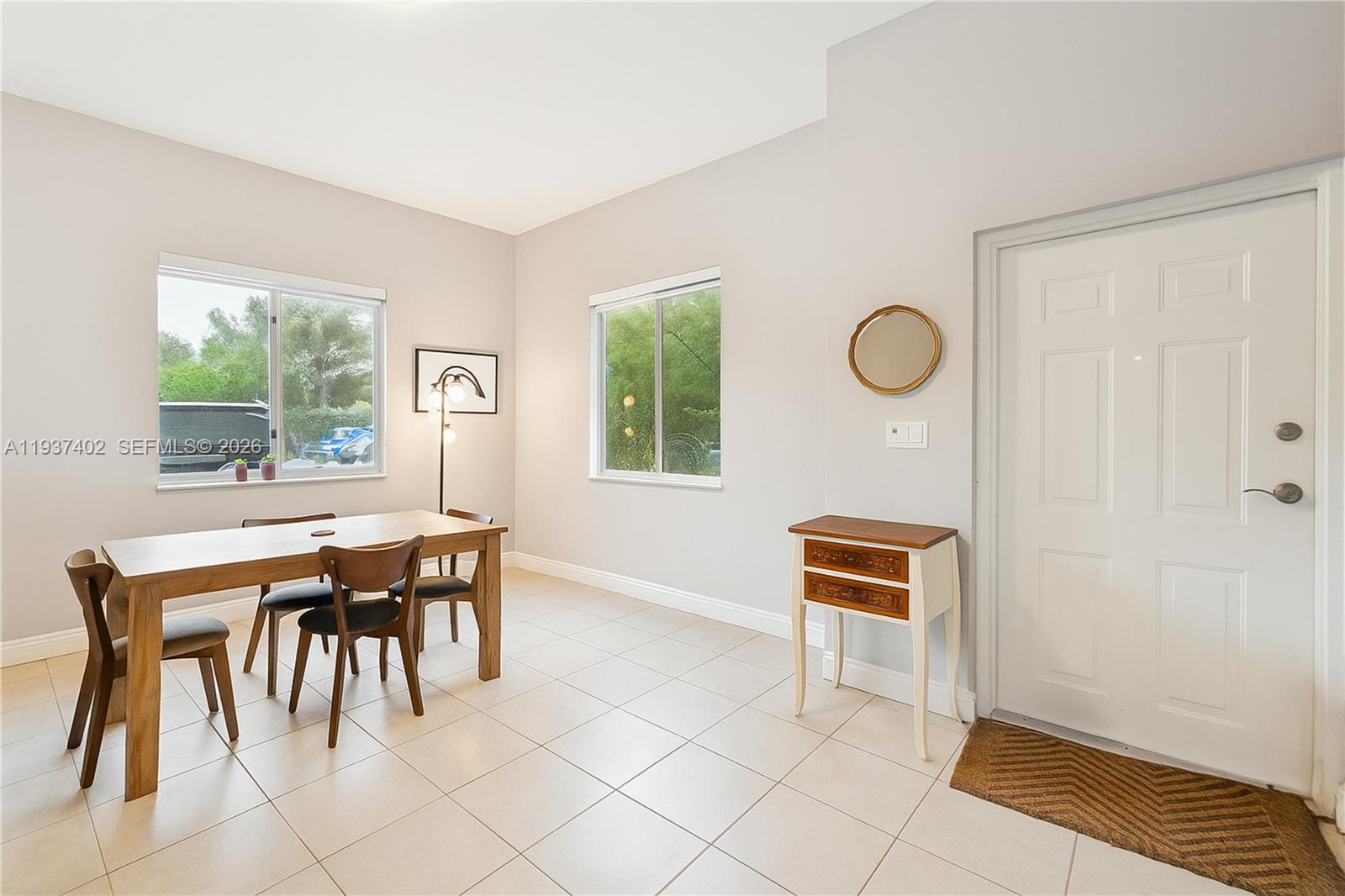 2730 Southwest 26th Street, Unit 2730 Miami, FL 33133 - Photo 7 of 21 a dining room with furniture and window