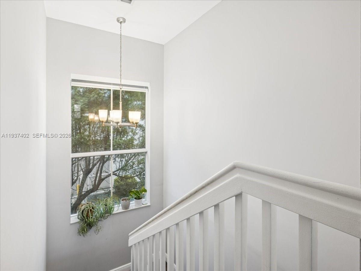 2730 Southwest 26th Street, Unit 2730 Miami, FL 33133 - Photo 9 of 21 a view of a hallway with windows