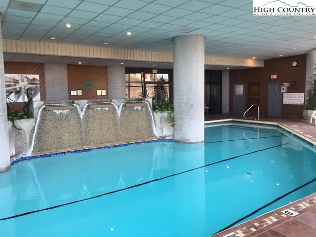 a view of a swimming pool with a sitting space