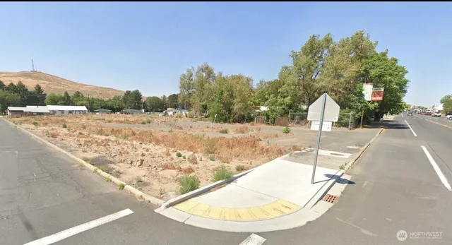 a view of a swimming pool with a yard