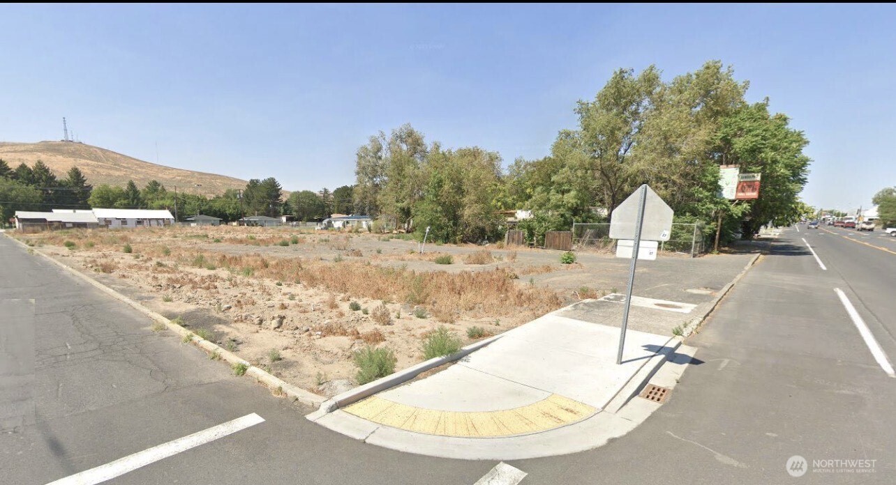 a view of a swimming pool with a yard