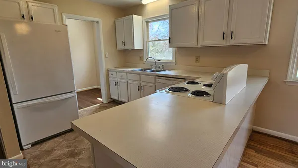 a utility room with cabinets