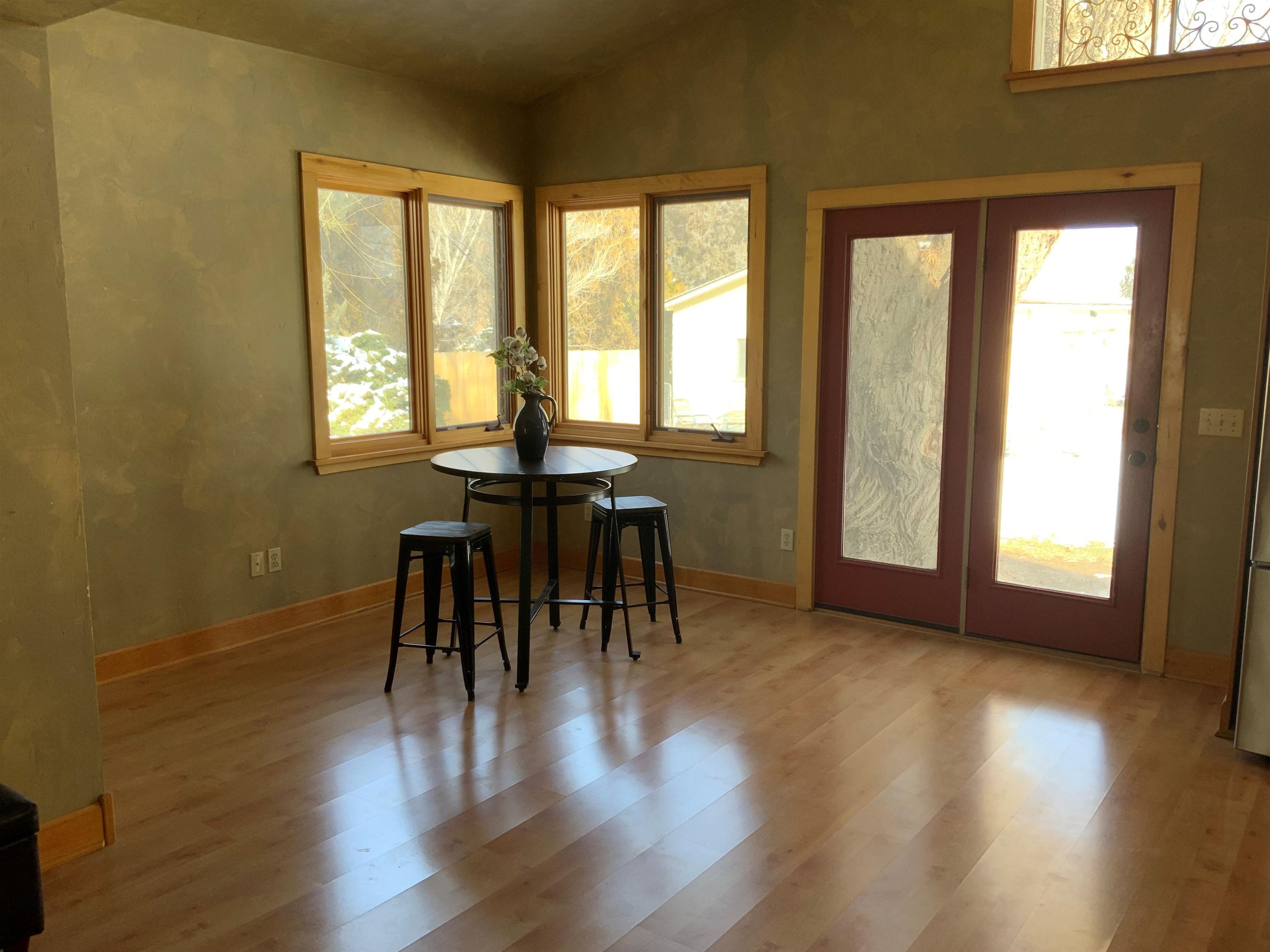 734-36 36 3/10 Road Palisade, CO 81526 - Photo 11 of 39 a view of a dining room with furniture and wooden floor