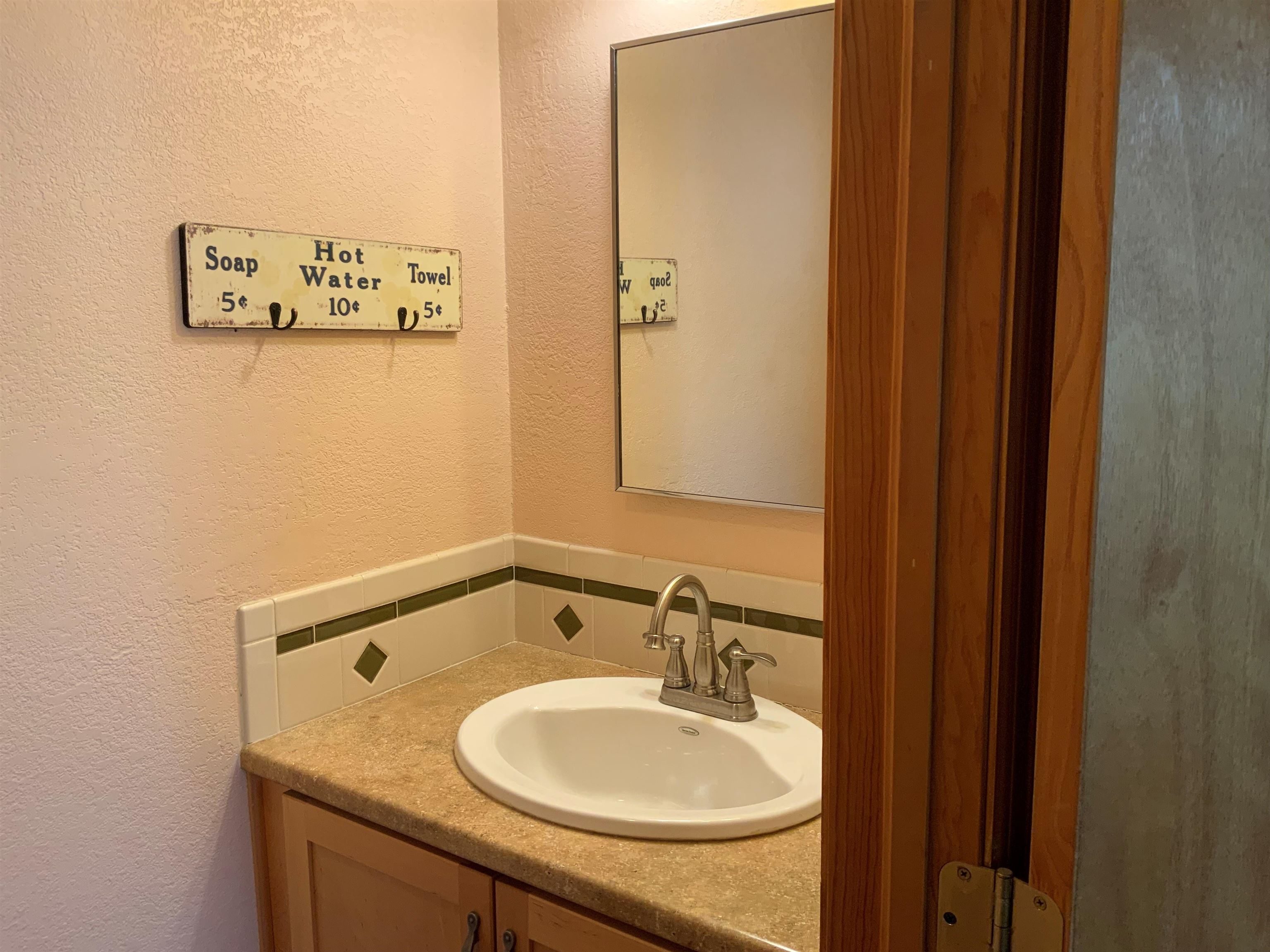 734-36 36 3/10 Road Palisade, CO 81526 - Photo 14 of 39 a bathroom with a sink and a mirror