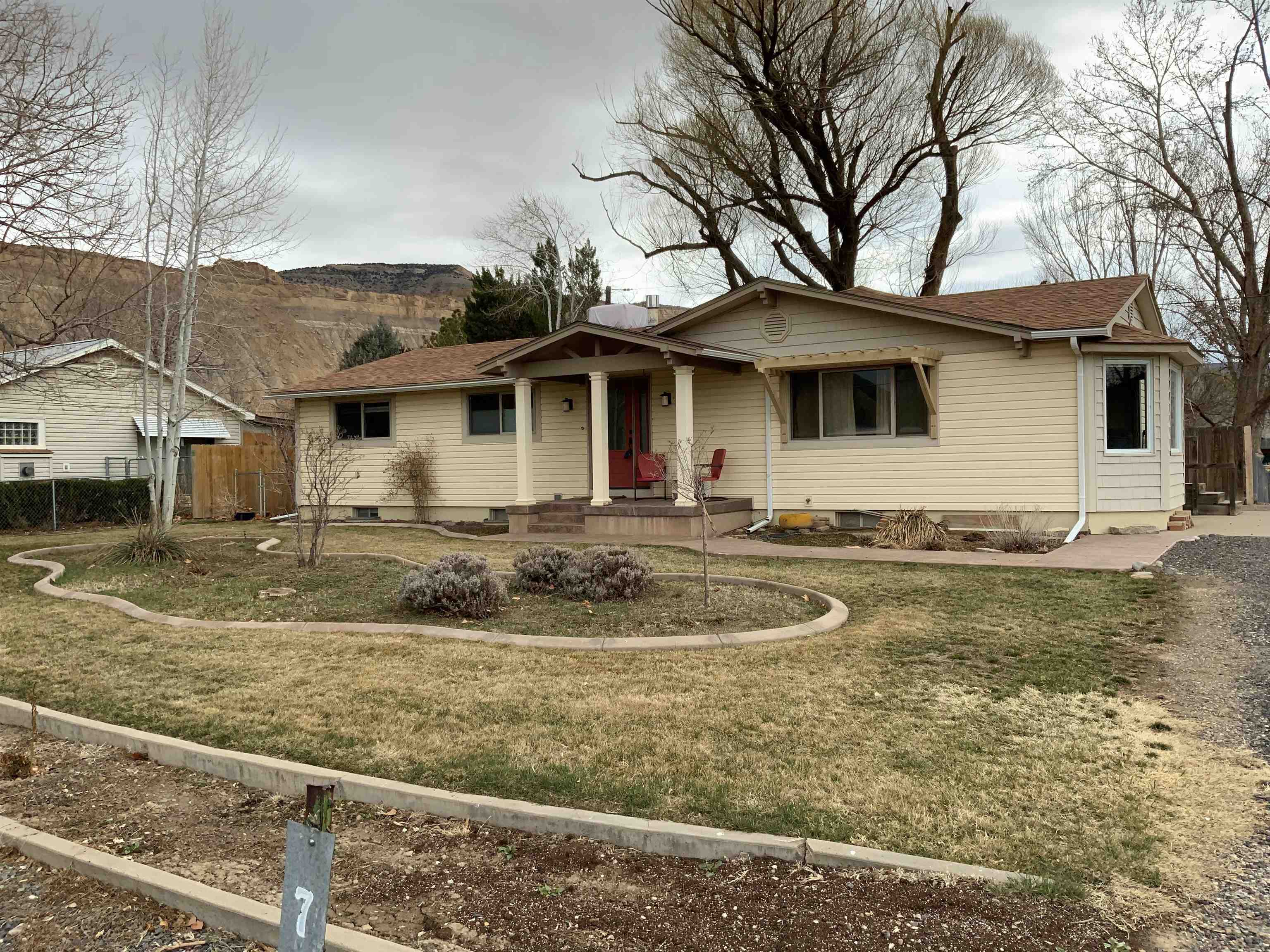 734-36 36 3/10 Road Palisade, CO 81526 - Photo 3 of 39 a front view of a house with garden