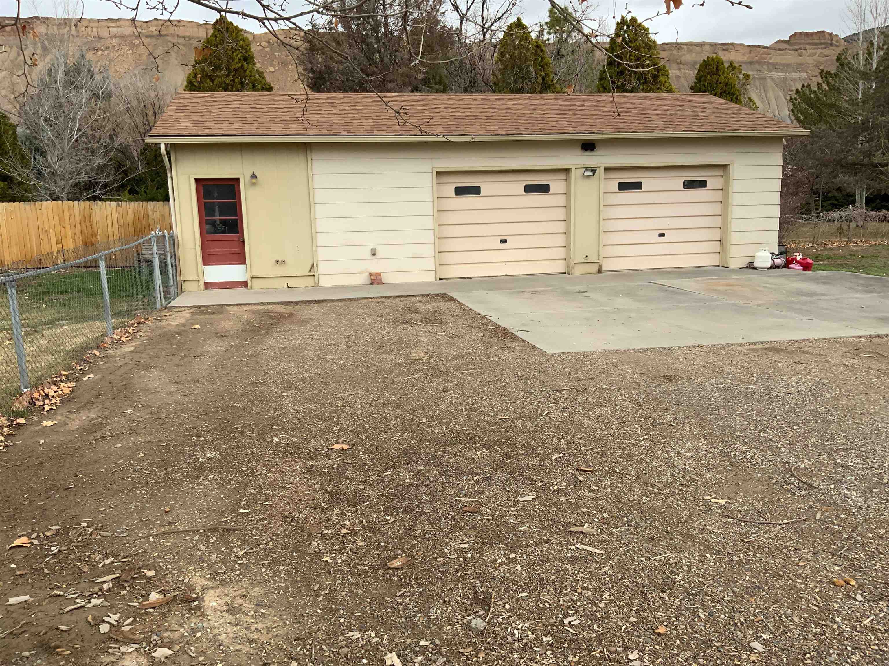 734-36 36 3/10 Road Palisade, CO 81526 - Photo 34 of 39 a view of a house with a yard and garage