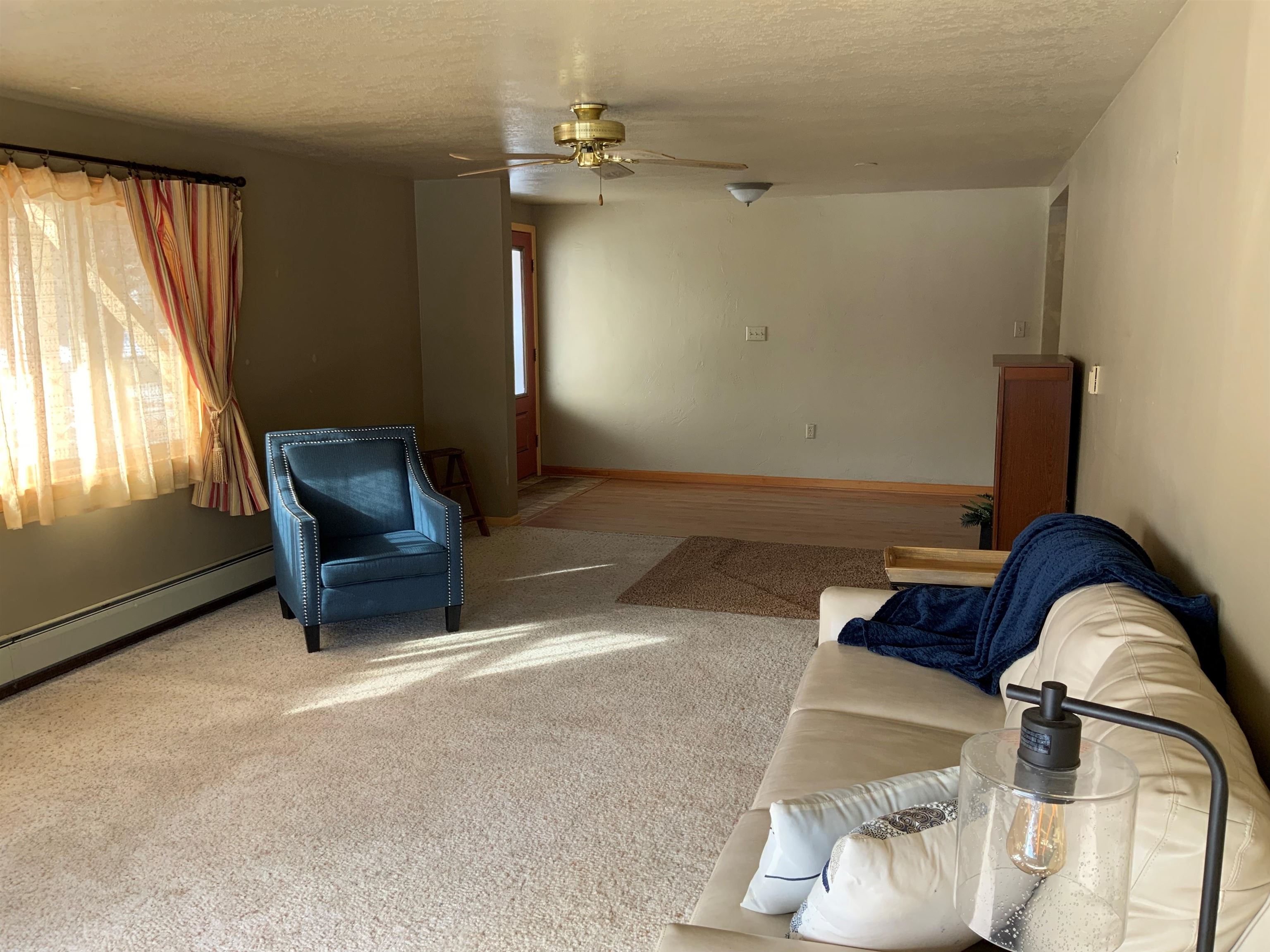 734-36 36 3/10 Road Palisade, CO 81526 - Photo 6 of 39 a living room with furniture and a window