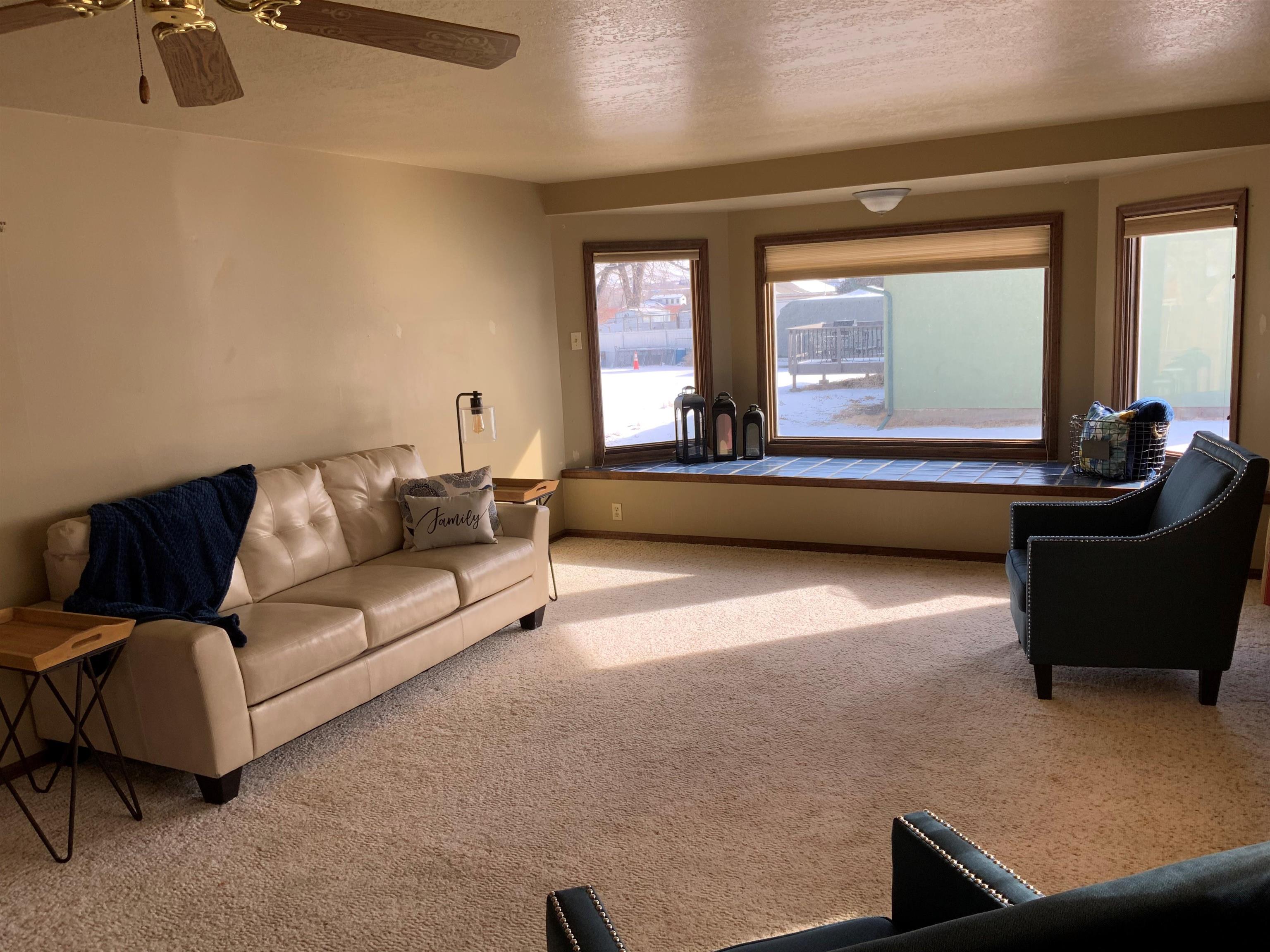 734-36 36 3/10 Road Palisade, CO 81526 - Photo 7 of 39 a living room with a couch
