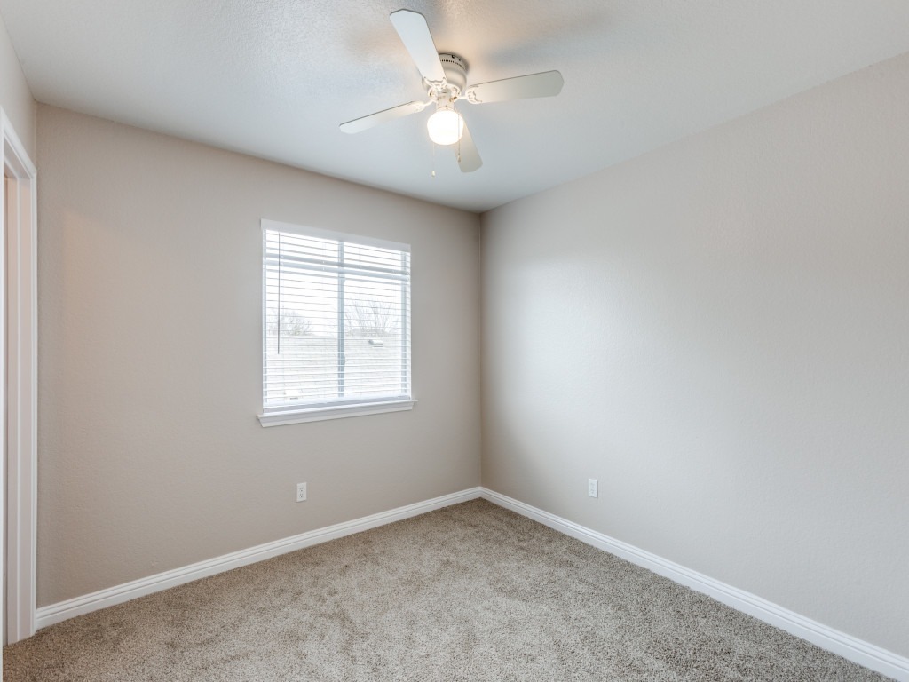 3005 Crownover Street Austin, TX 78725 - Photo 15 of 25 an empty room with a window and a fan