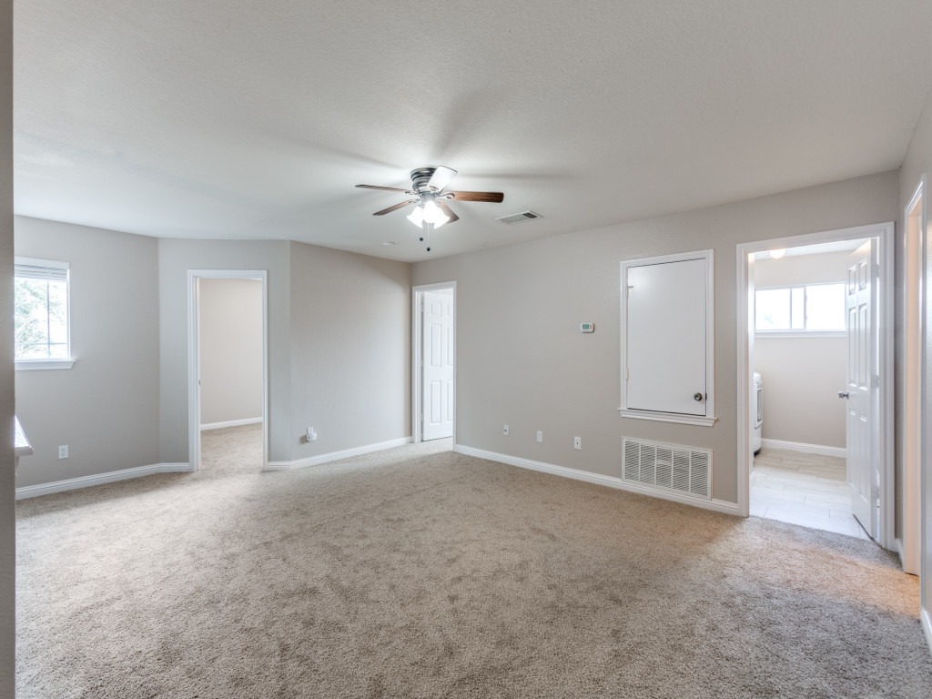 3005 Crownover Street Austin, TX 78725 - Photo 20 of 25 a view of an empty room with a ceiling fan