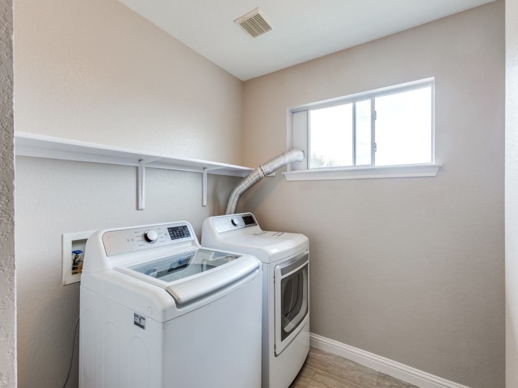 3005 Crownover Street Austin, TX 78725 - Photo 21 of 25 a utility room with dryer and washer