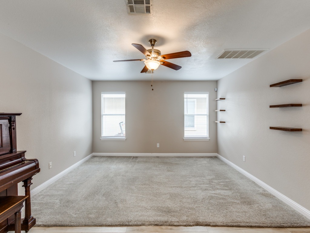 3005 Crownover Street Austin, TX 78725 - Photo 4 of 25 a view of an empty room with a window