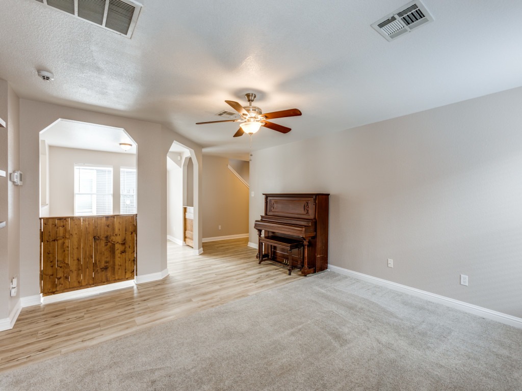 3005 Crownover Street Austin, TX 78725 - Photo 5 of 25 a view of a livingroom with a piano and entryway