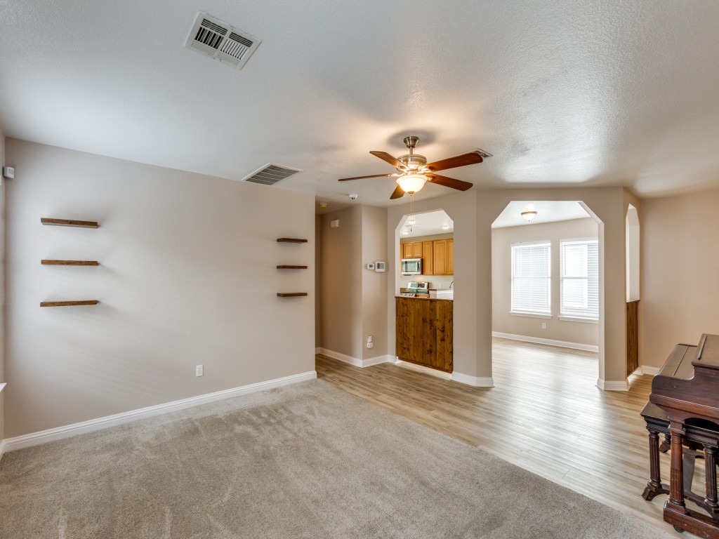 3005 Crownover Street Austin, TX 78725 - Photo 6 of 25 wooden floor in an empty room with a window