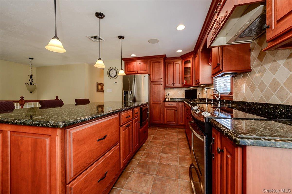 784 Newbridge Road Bellmore, NY 11710 - Photo 3 of 27 Pendant lighting over island