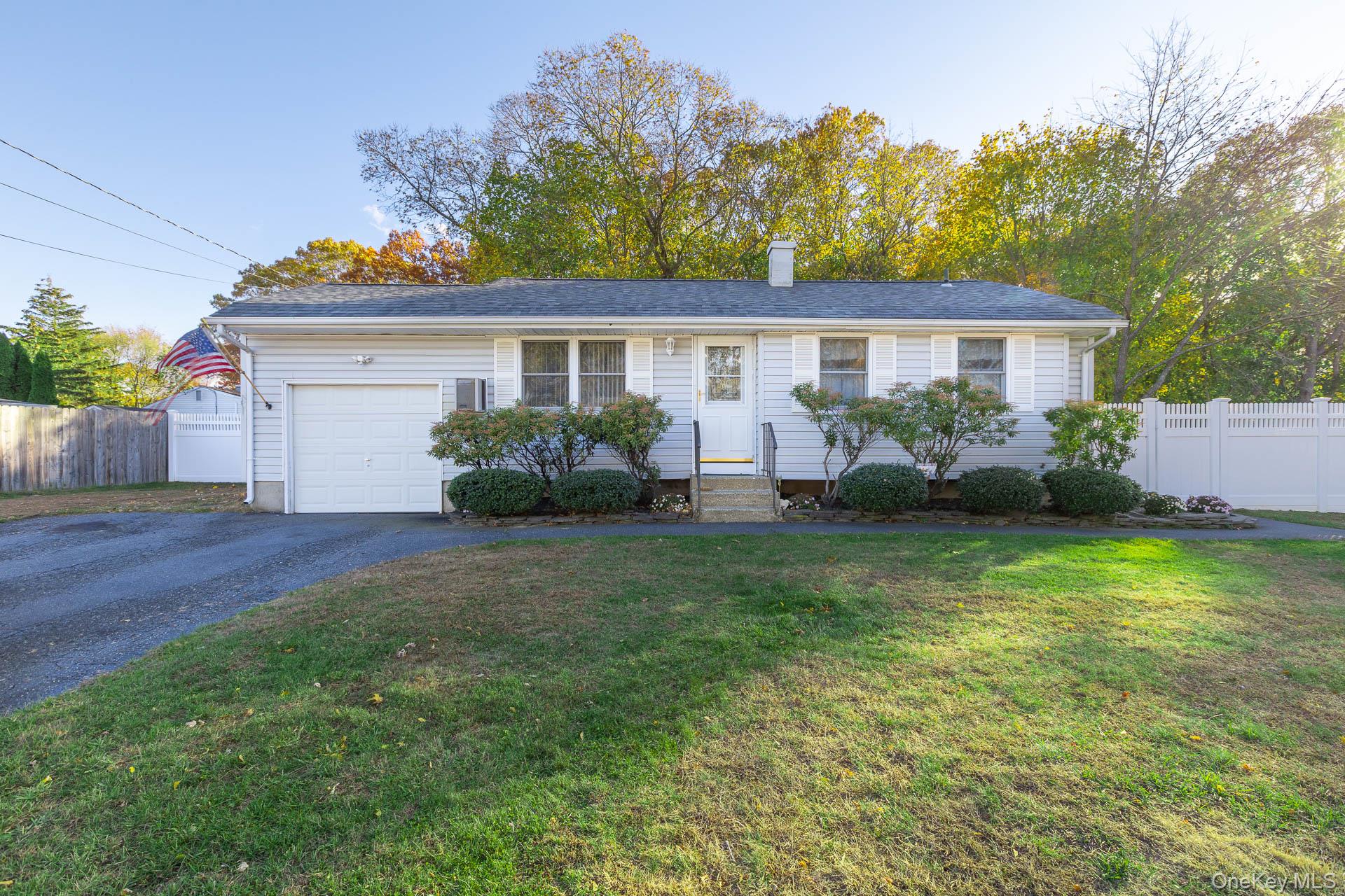 6 Talbot Lane Selden, NY 11784 - Photo 12 of 12 a front view of a house with garden