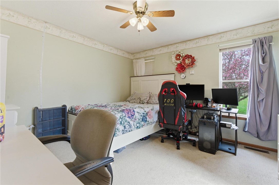 8747 Waynes Way Blanchester, OH 45107 - Photo 16 of 40 This spacious bedroom offers comfortable living with soft carpeting and natural light.