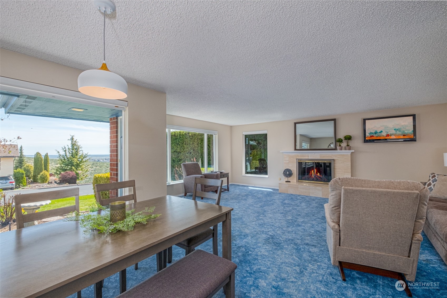 451 Statter Road Ephrata, WA 98823 - Photo 3 of 23 a living room with furniture a fireplace and a table