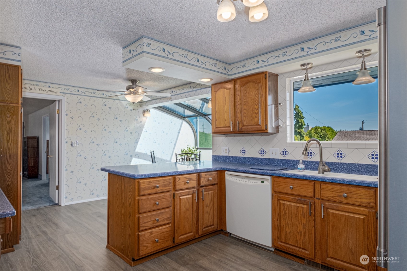 451 Statter Road Ephrata, WA 98823 - Photo 7 of 23 a kitchen with a sink cabinets and wooden floor