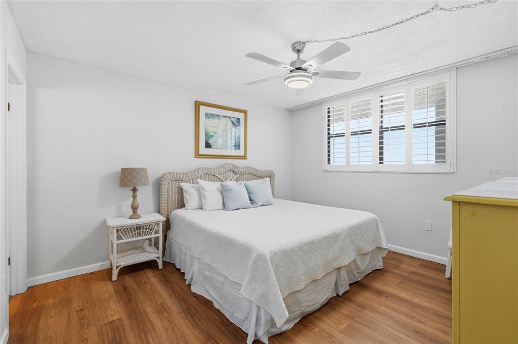 15462 Gulf Boulevard, Unit 601 Madeira Beach, FL 33708 - Photo 26 of 40 a bedroom with a bed and a window