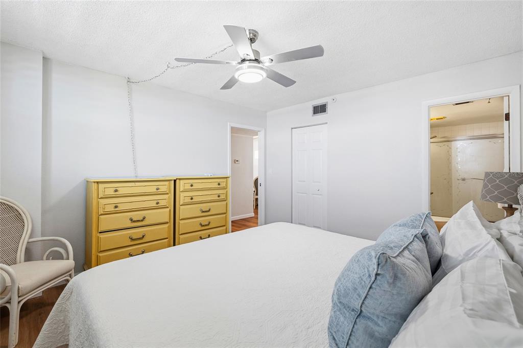 15462 Gulf Boulevard, Unit 601 Madeira Beach, FL 33708 - Photo 27 of 40 a bedroom with a bed and furniture