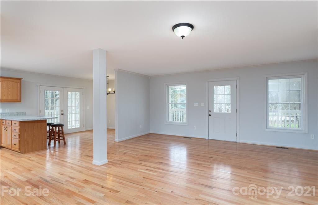 2381 Holbrook Road Fort Mill, SC 29715 - Photo 8 of 27 a view of empty room with wooden floor and fireplace