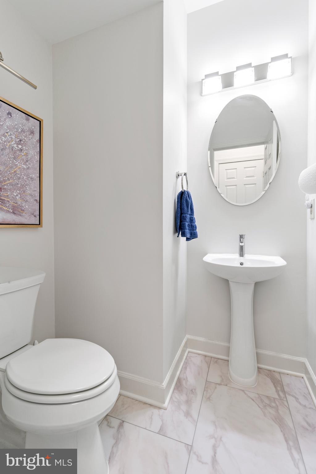 2803 Shadowridge Drive Olney, MD 20832 - Photo 17 of 55 a bathroom with a sink toilet and a mirror