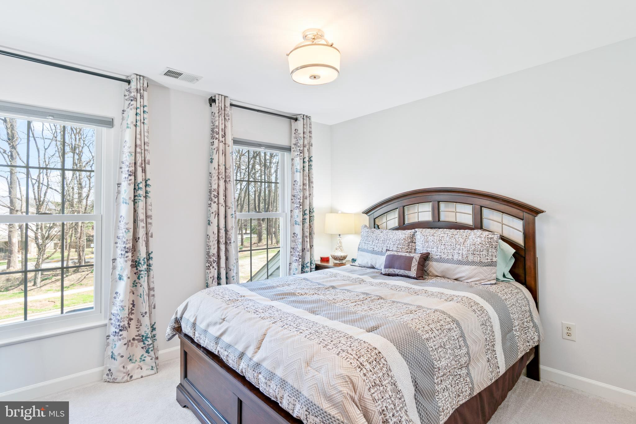 2803 Shadowridge Drive Olney, MD 20832 - Photo 21 of 55 a bedroom with a large bed and a window