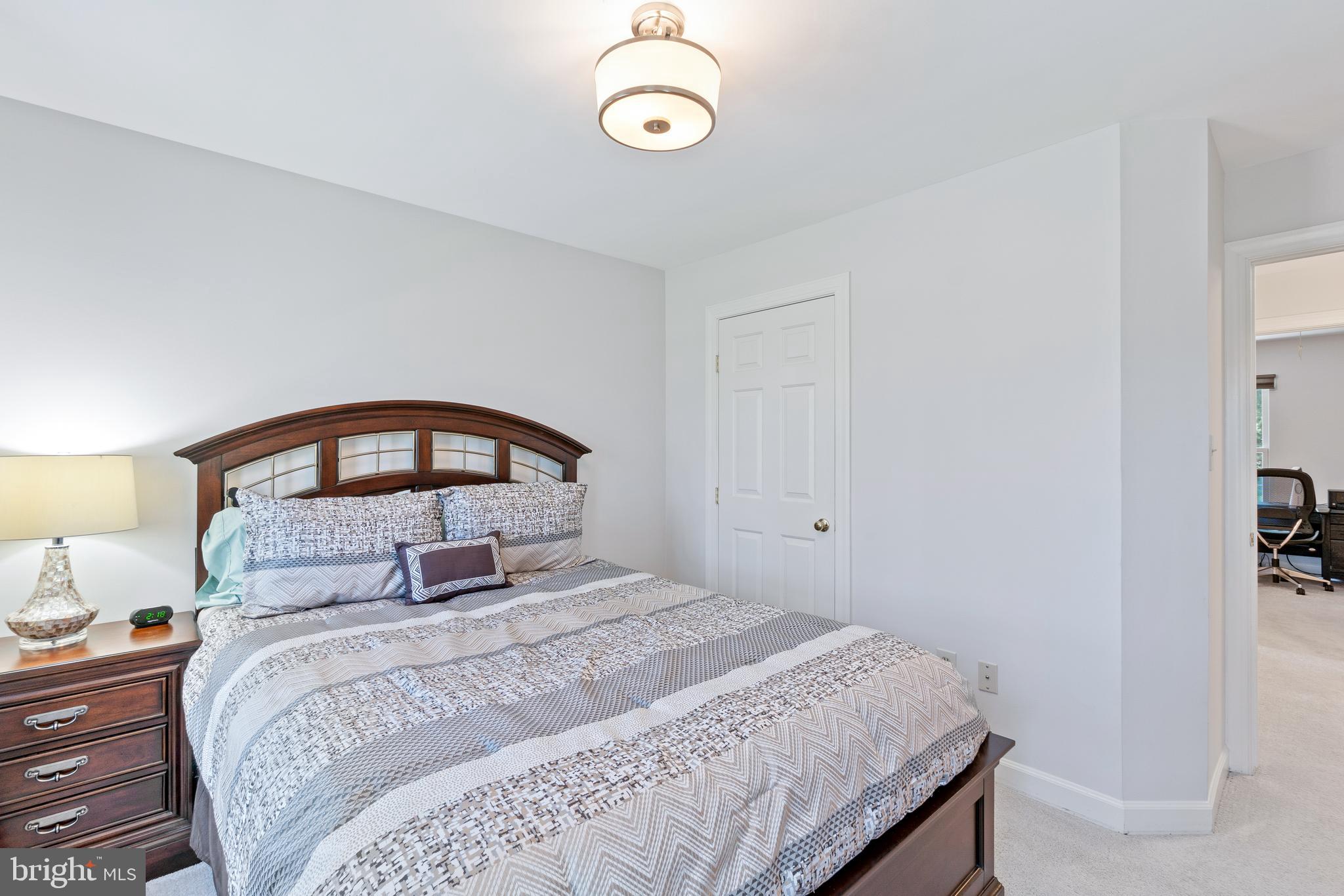 2803 Shadowridge Drive Olney, MD 20832 - Photo 22 of 55 a bedroom with a bed and a window