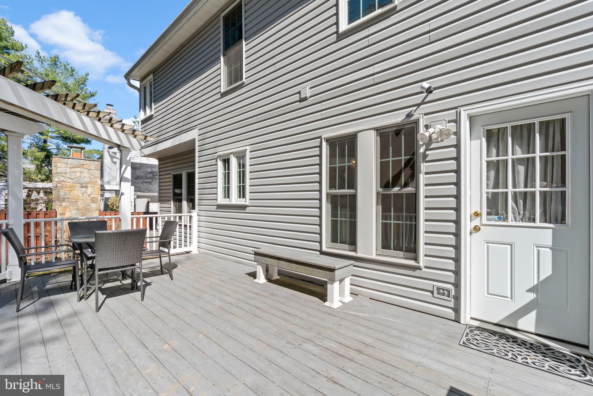 2803 Shadowridge Drive Olney, MD 20832 - Photo 43 of 55 a view of a patio with a table and chairs and wooden floor