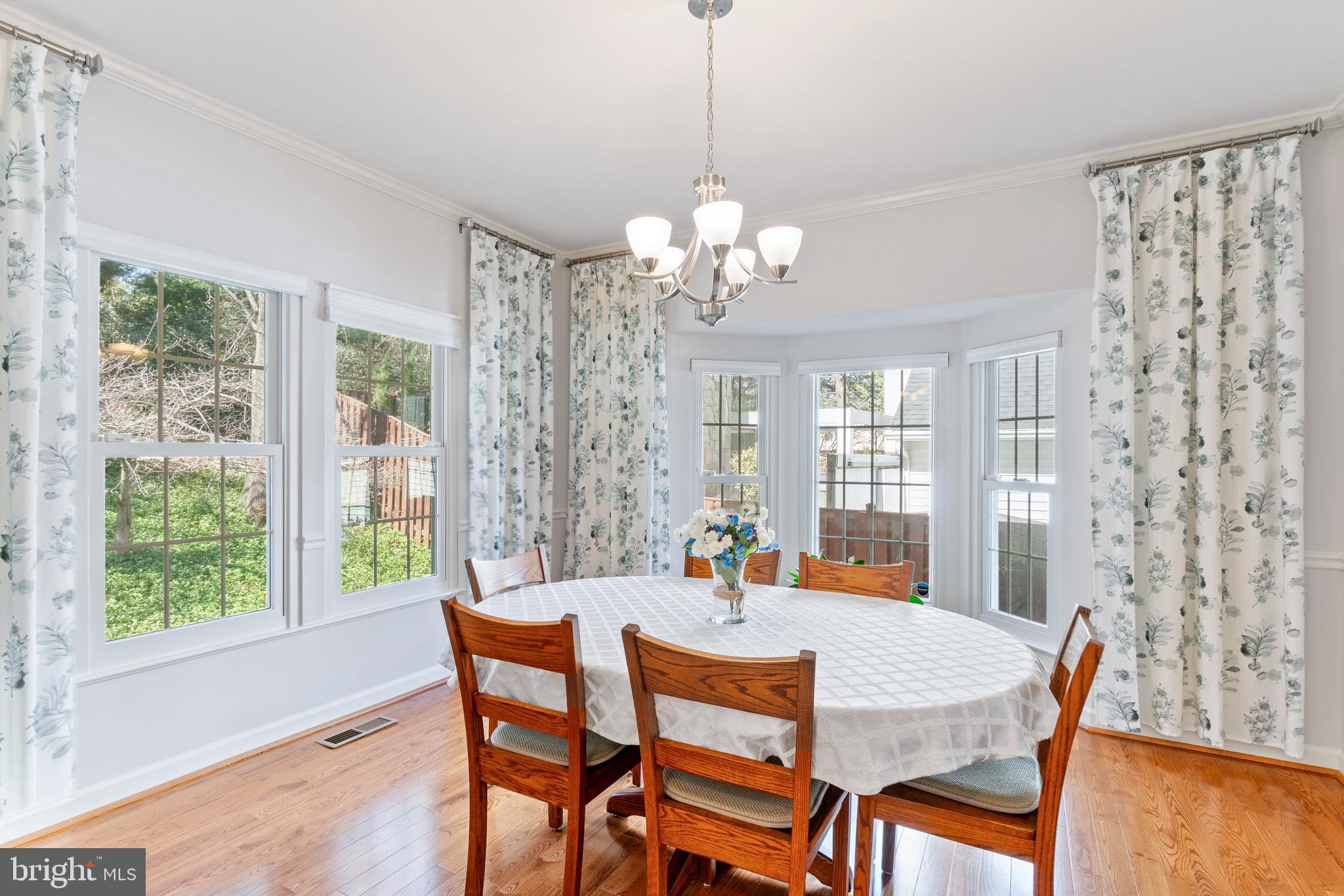 2803 Shadowridge Drive Olney, MD 20832 - Photo 5 of 55 a dining room with furniture a chandelier and window