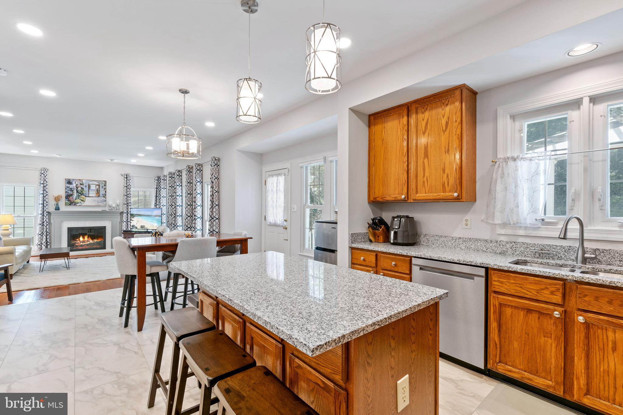 2803 Shadowridge Drive Olney, MD 20832 - Photo 7 of 55 a kitchen with a table chairs and refrigerator