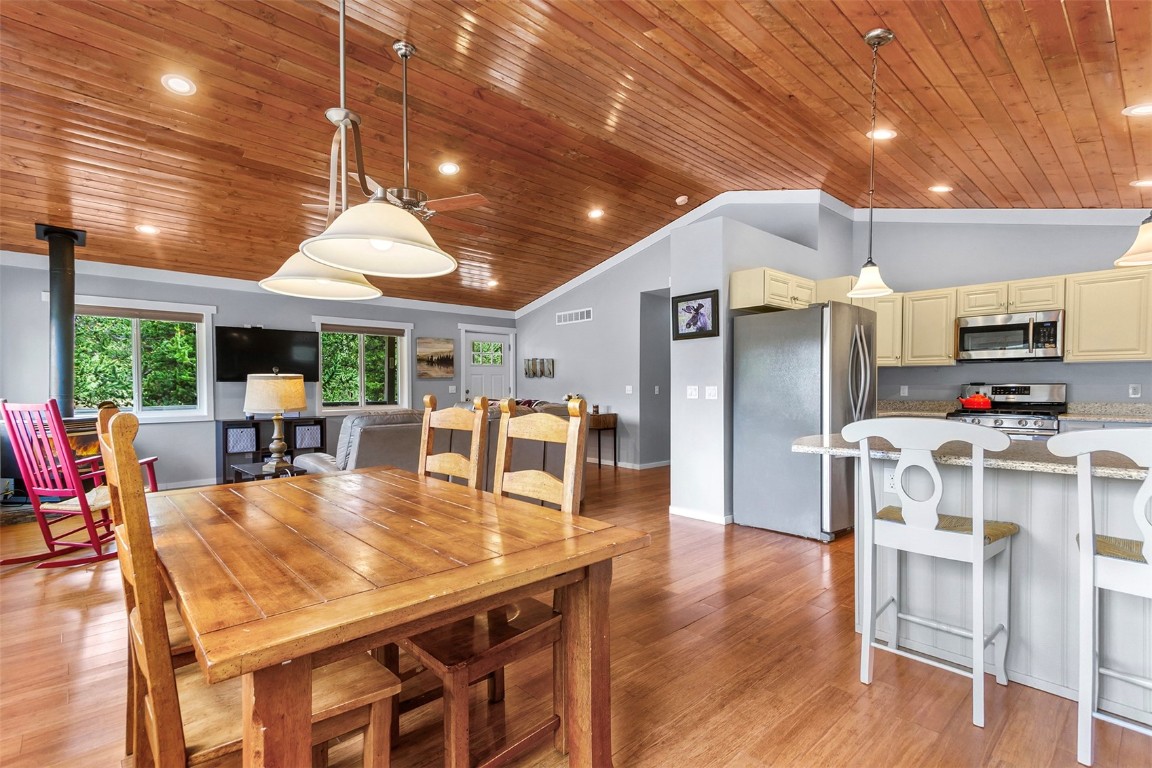 485 High Creek Road Fairplay, CO 80440 - Photo 1 of 32 a dining room with furniture a chandelier and wooden floor