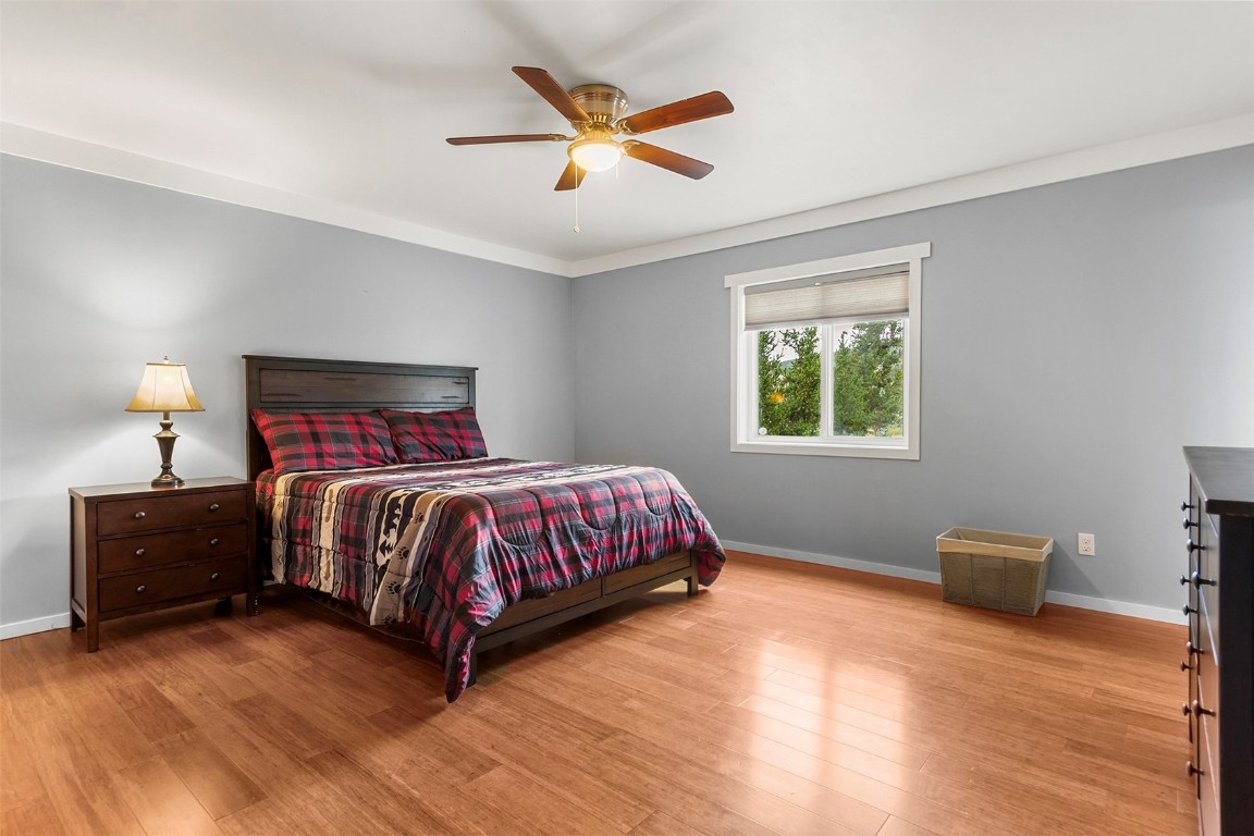 485 High Creek Road Fairplay, CO 80440 - Photo 15 of 32 a bedroom with a bed and a ceiling fan