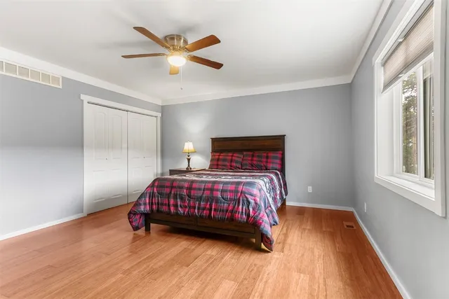 a bedroom with a bed and window