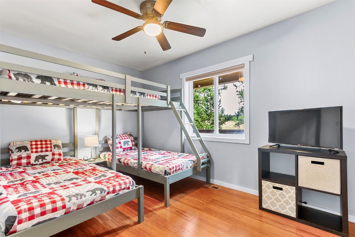 485 High Creek Road Fairplay, CO 80440 - Photo 19 of 32 a bedroom with a bed and a flat screen tv