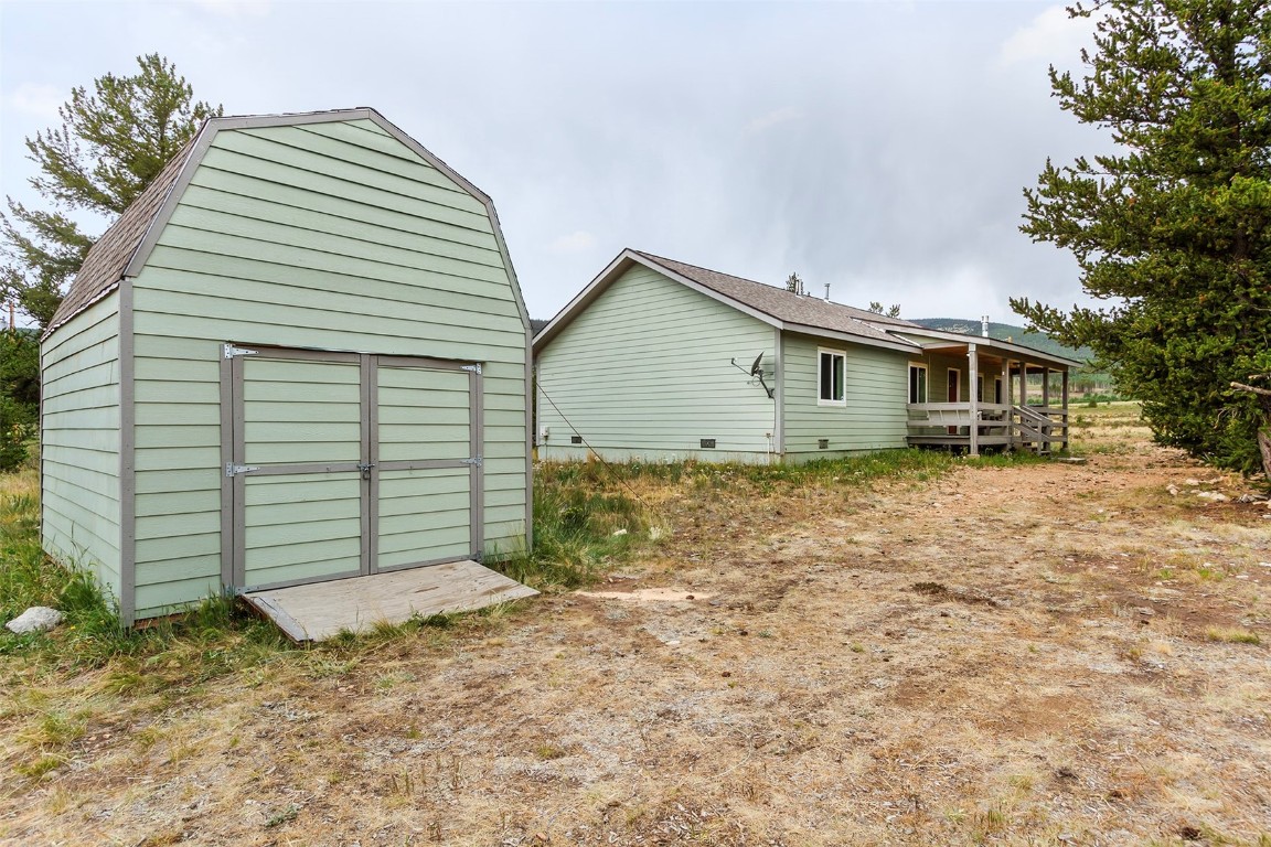 485 High Creek Road Fairplay, CO 80440 - Photo 29 of 32 a view of a house with a yard and garage