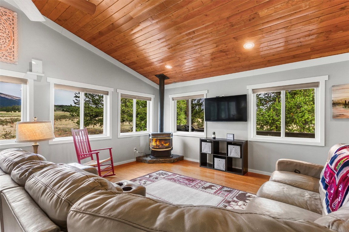 485 High Creek Road Fairplay, CO 80440 - Photo 4 of 32 a bedroom with furniture and large windows