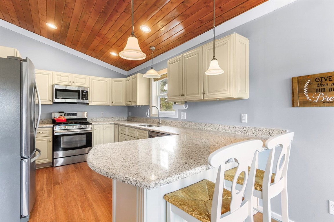 485 High Creek Road Fairplay, CO 80440 - Photo 9 of 32 a kitchen with stainless steel appliances granite countertop a sink a stove and cabinets