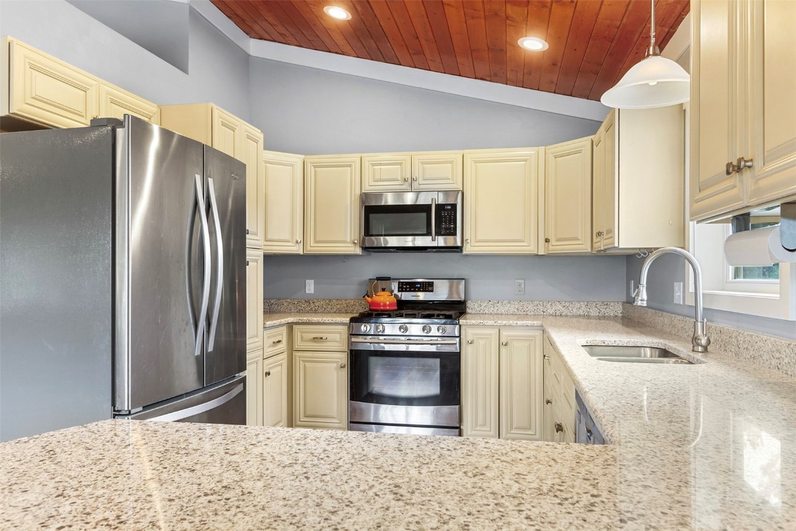 485 High Creek Road Fairplay, CO 80440 - Photo 10 of 32 a kitchen with stainless steel appliances granite countertop a refrigerator sink and stove