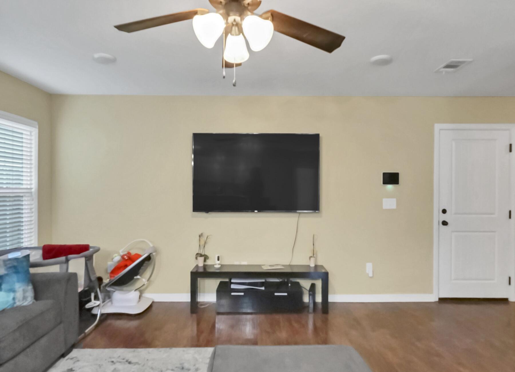 220 Wainwright Drive Crestview, FL 32539 - Photo 18 of 56 a living room with furniture and a flat screen tv