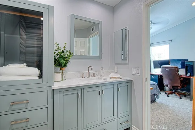 a bathroom with a sink and a mirror
