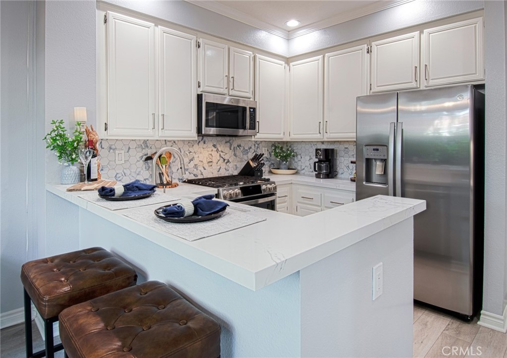 81 Pasto Rico Rancho Santa Margarita, CA 92688 - Photo 8 of 49 Everyone will love gathering in the designer kitchen!